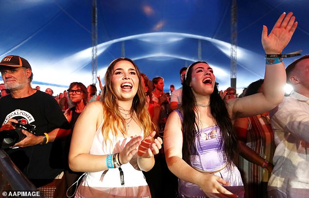 Complaints on the page include fans who have had their credit cards flagged by their banks, while others have had their scam alerts activated.  Fans at the festival are pictured