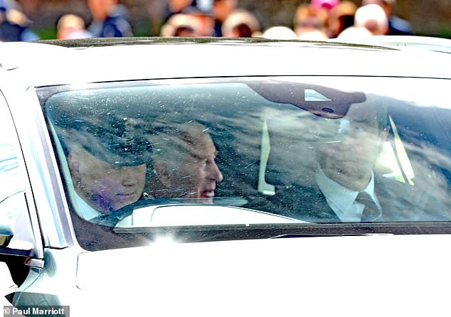 The 75-year-old monarch appeared in good spirits as he smiled in the backseat of a car as it drove past onlookers