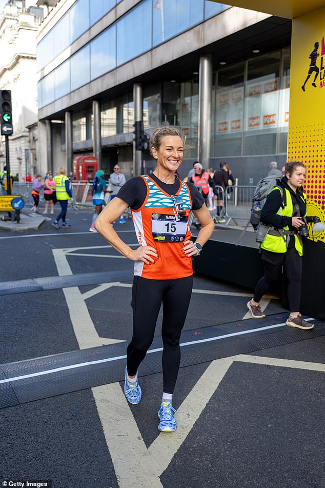 Lois chose to wear bright orange shorts and a black long-sleeved gym top, with white running shoes