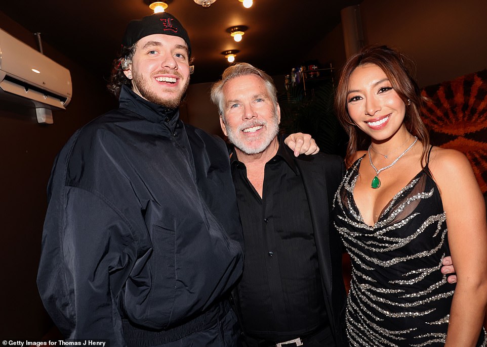 Jack Harlow, Thomas J. Henry and Evelin Crossland pose for a photo just before the rapper took the stage