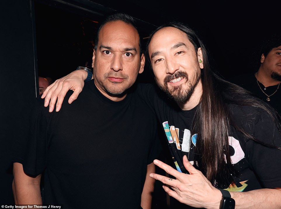 Steve Aoki posed with TJH Law Vice President Ruben Herrera after his energetic nightclub performance