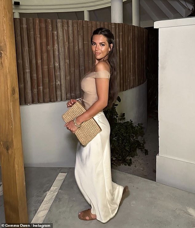 Michael Owen's daughter looked radiant in another photo during a dinner out, wearing a cream satin skirt and an off-the-shoulder top