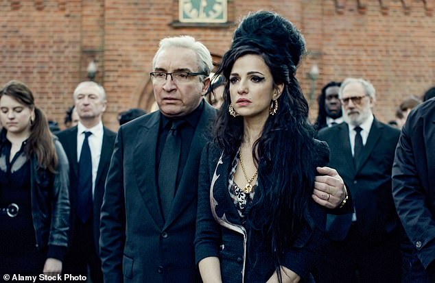 Friends expressed their anger at her father after he allowed creepy scenes of Amy's drug overdose to be filmed in her old flat (Marisa pictured with Eddie Marsan as Mitch Winehouse)