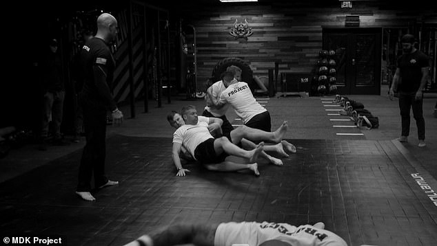 Promotional images from the boot camp's website show participants wrestling and taking ice baths