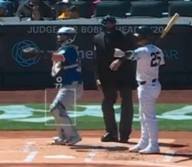 Angel Hernandez calls it a hit anyway - despite the fact that it's a dead throw that missed the zone about two inches too high.  Gleyber Torres (25) protests against the zero.