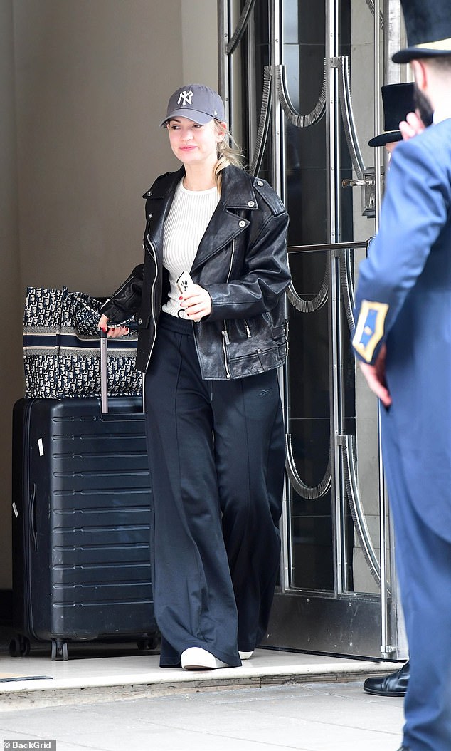 British actress Lily James is spotted checking out of her Central London Hotel and heading to Milan