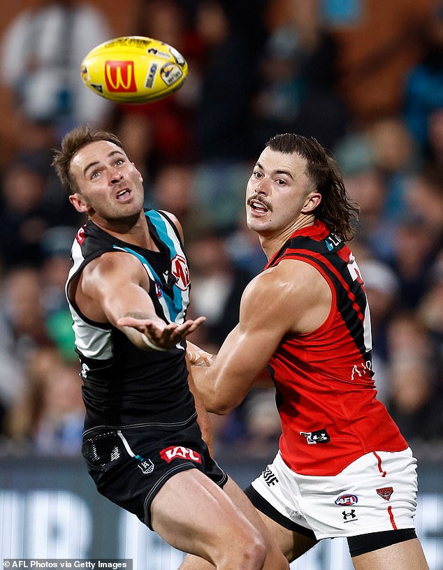 Finlayson (pictured left during Friday night's win) was congratulated by South Australian Premier Peter Malinauskas for quickly apologizing after using the slur