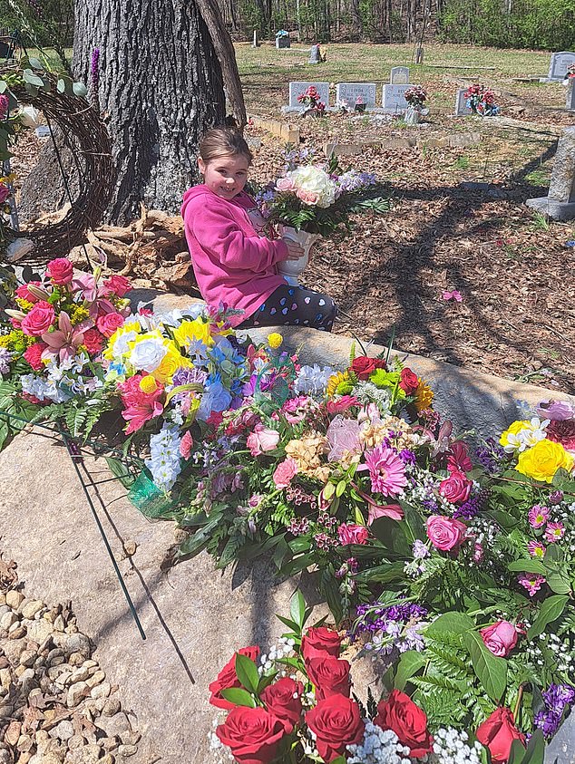 In one post, Emouree was seen at a cemetery smiling with flowers around her