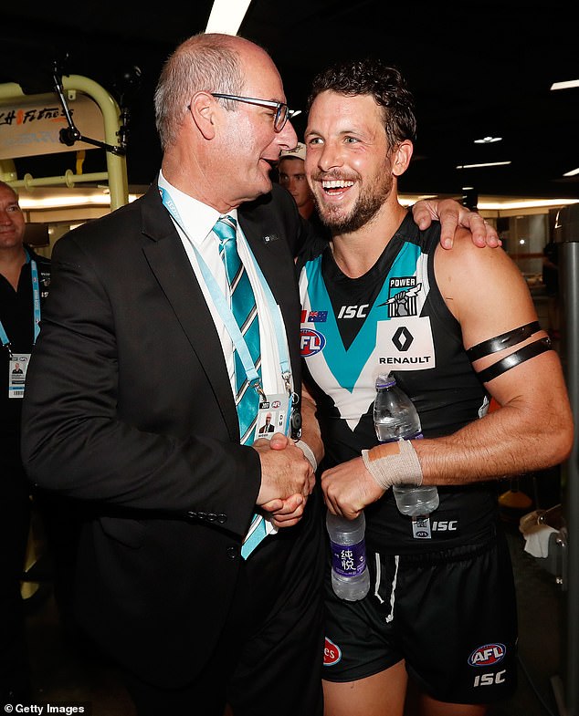 Port chairman David Koch (pictured with Power star Travis Boak after a match) has also been criticized by fans who thought he was downplaying the severity of Finlayson's outburst