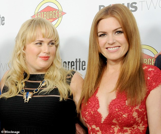 The announcement came after Rebel Wilson made shocking claims about her experience with 'a**hole' comedian Sacha in her new memoir, Rebel Rising (Rebel, left, pictured with Isla at the Los Angeles premiere of their film Bachelorette in 2012)