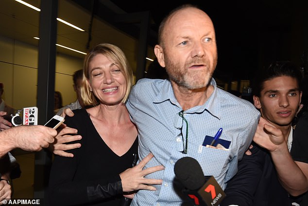 Brown and 60 Minutes producer Stephen Rice are pictured arriving home at Sydney airport after spending two weeks behind bars on child abduction charges