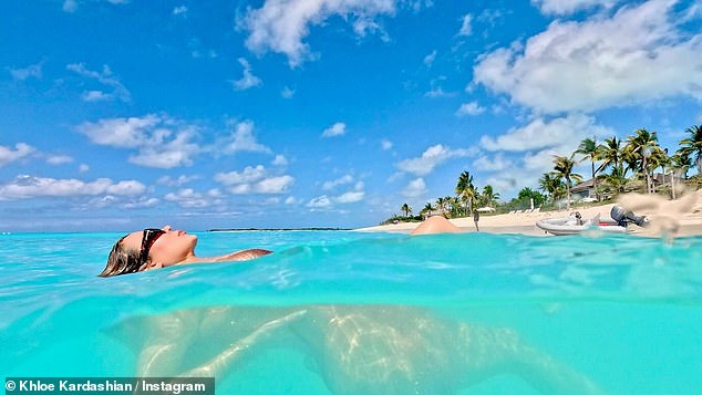 Earlier this week, Khloé rocked a pink one-piece swimsuit for Kate Hudson's brand Fabletics and debuted new, dark red locks that looked stunning.