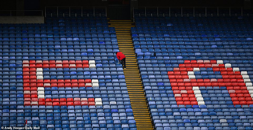 A steward cleared the seats at Selhurst Park in the calm before the storm, with Manchester City later beating Crystal Palace