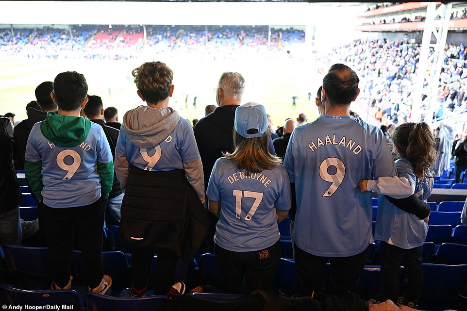 A family of five took their seats at City's away match, each wearing their own custom-made City home shirt