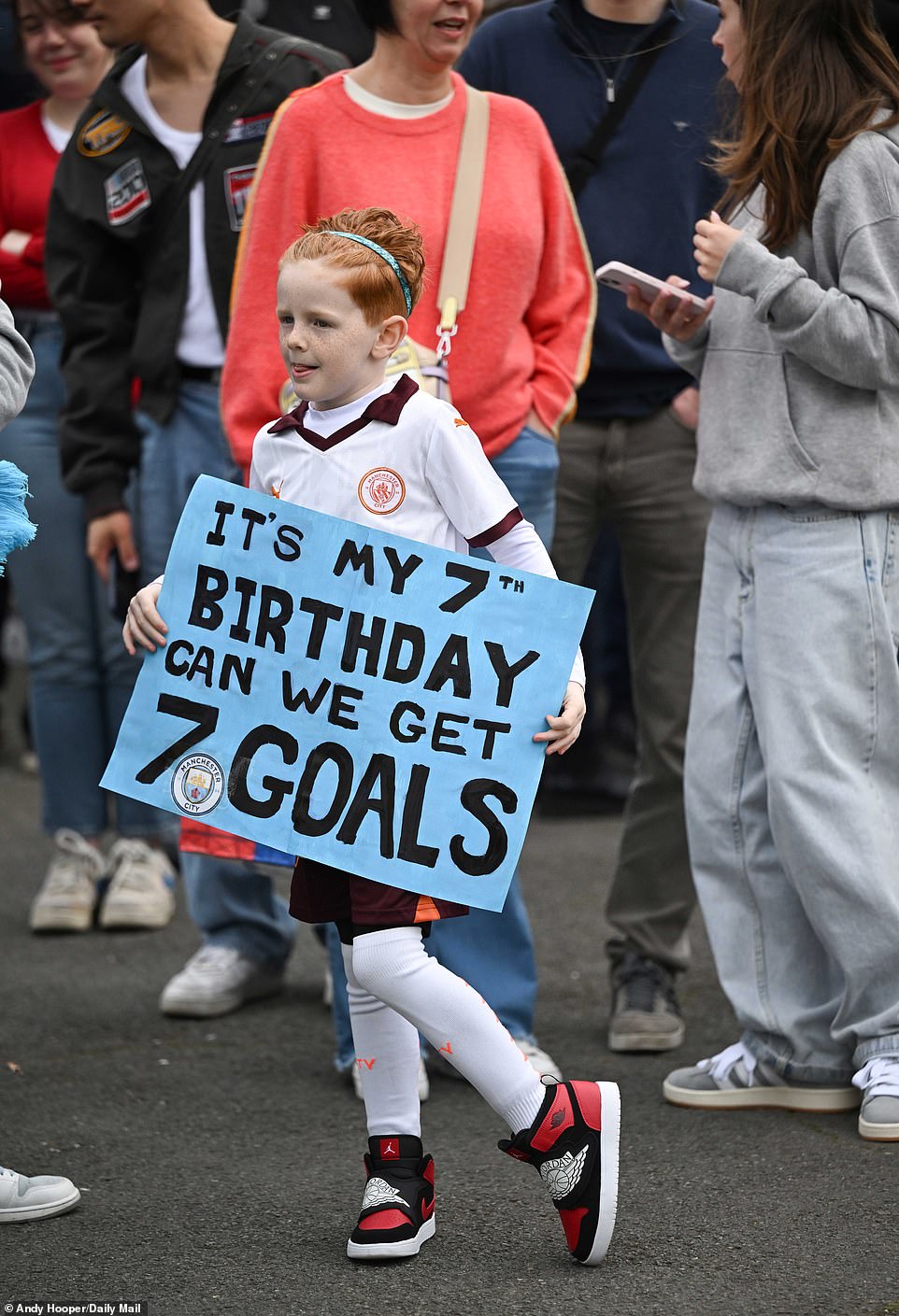 A young City supporter brought a homemade sign to the ground reading 'It's my birthday, can we score seven goals?'