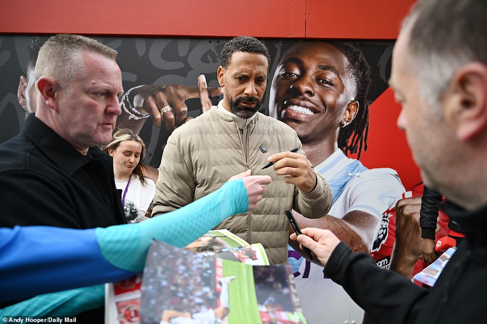 Manchester United and England legend Rio Ferdinand, now a pundit, signed autographs before starting his broadcasting duties