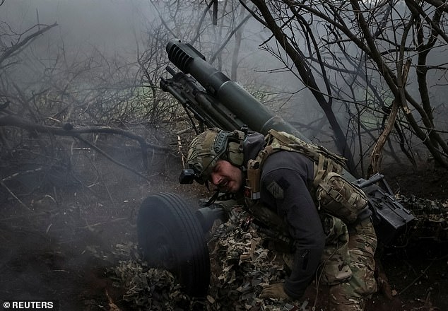 A soldier from the 12th Special Forces Brigade Azov of the National Guard of Ukraine fires a howitzer at Russian troops in the Donetsk region, Ukraine, April 5, 2024