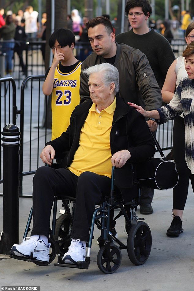 Wilson, 81, appeared reserved as he was pushed in his wheelchair as he arrived at Crypto.com Arena in Los Angeles to attend the Lakers' game against the Minnesota Timberwolves.