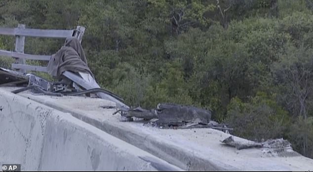 The bus plunged into a ravine after the driver lost control of the vehicle and crashed into barriers on the bridge