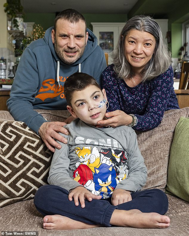 After 'endless' medical testing, an MRI confirmed he has mitochondrial disease, which causes cells to not produce enough energy.  His parents, Simon, 45, (left) and Mihaela, 43, (right) say he went from a normal, healthy little boy to paralysis from seizures, seemingly overnight.