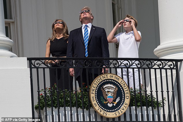 Trump later used the protective eye as he watched the partial solar eclipse with former first lady Melania and son Barron