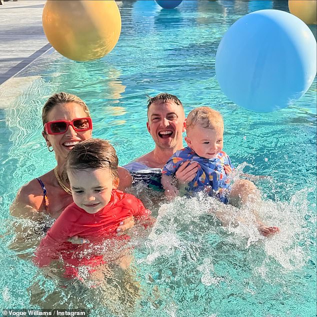 Elsewhere, the group splashed in the pool with their children as they cooled down from the heat, while Vogue held her youngest son, Otto.