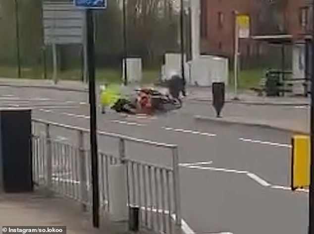 The chase ensued on his own motorcycle and soon took an unexpected turn after the officer collided with the suspect, leaving them both sprawled across the road.