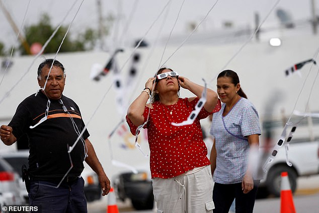 A woman uses special goggles to observe the solar eclipse in Torreon, Mexico