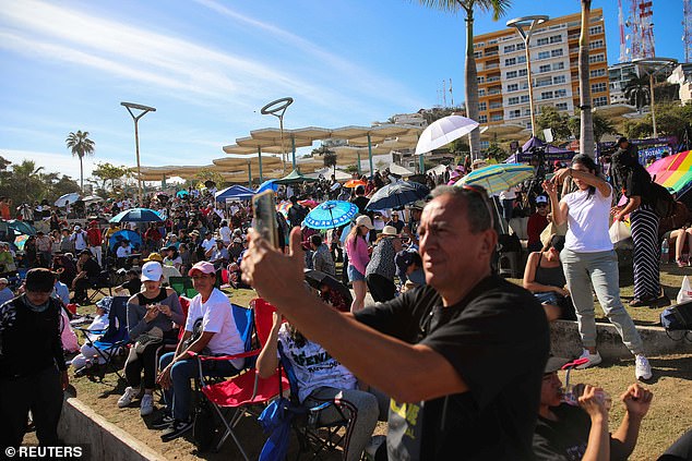 People gather and wait to observe a total solar eclipse in Mazatlan, Mexico