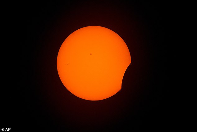 ARLINGTON, TEXAS: The beginning stages of a total solar eclipse are visible