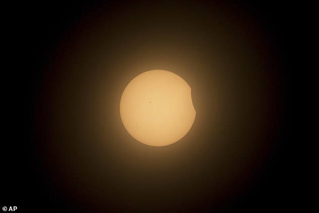 MAZATLAN, MEXICO: The moon partially covers the sun during a total solar eclipse