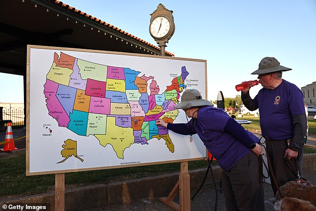 The eclipse appeared in Arkansas at 1:51 p.m.  Visitors add pins to a map to indicate where they are from