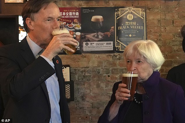 US Treasury Secretary Janet Yellen (right) and US Ambassador to China Nicholas Burns taste beer at Jing-A Brewery in Beijing