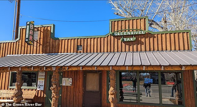 Not long after this photo was taken, witnesses said Roberts dragged or carried the animal through the Green River Bar (pictured) as customers watched