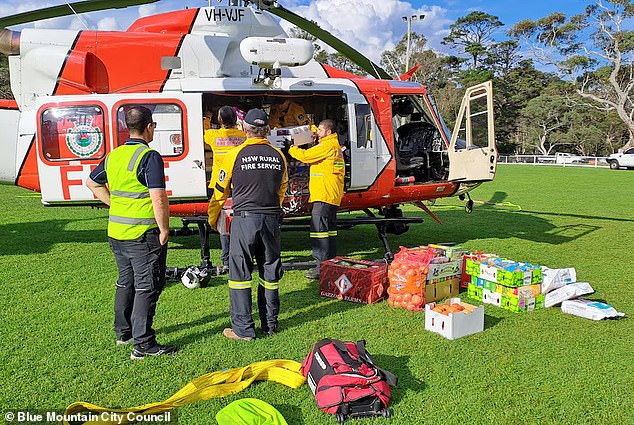 The Rural Fire Service has air-dropped essential supplies (pictured) to residents of Megalong Valley, in the Blue Mountains, who have been cut off after the only road out of town was damaged.