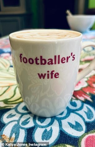 Katya also sent a teasing photo of a 'football wife' mug