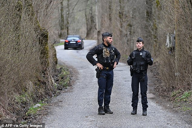 French gendarmes on their way to the French Southern Alps discuss the small village of Le Haut-Vernet, in Le Vernet on March 31, 2024, after French investigators 