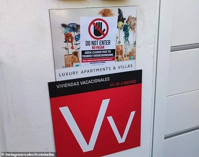 Anti-tourism activists also put up posters at the door of luxury apartments, which also read: 'area closed due to overcrowding by tourists'