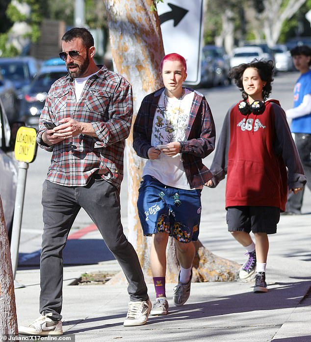 The step-siblings were photographed with Affleck on a Los Angeles street on February 12, with Fin wearing a striking temporary pink paint job.