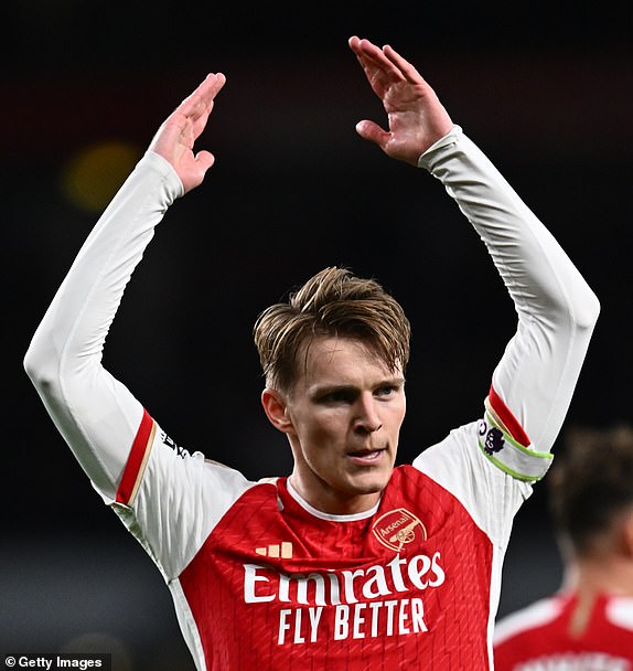 LONDON, ENGLAND – APRIL 3: Martin Odegaard of Arsenal FC celebrates after scoring a goal during the Premier League match between Arsenal FC and Luton Town at Emirates Stadium on April 3, 2024 in London, England.  (Photo by Sebastian Frej/MB Media/Getty Images)