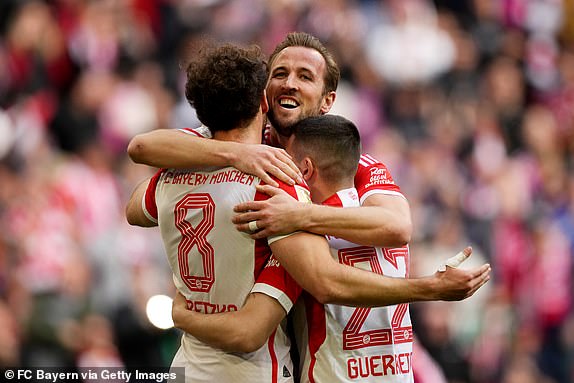 MUNICH, GERMANY – MARCH 09: Leon Goretzka of Bayern Munich celebrates scoring his team's second goal with teammates Harry Kane and Raphael Guerreiro during the Bundesliga match between FC Bayern Munich and 1. FSV Mainz 05 at the Allianz Arena on 9 March 2024 in Munich, Germany.  (Photo by M. Donato/FC Bayern via Getty Images)