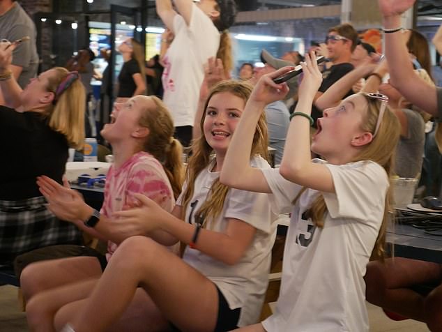 Families gathered to watch the eclipse and three young girls' jaws dropped as the moon eclipsed the sun.  Just minutes earlier, they expressed concern that cloud cover would obscure their view of the eclipse