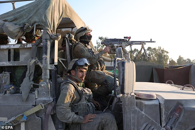 Israeli soldiers at a checkpoint along the Gaza border in southern Israel