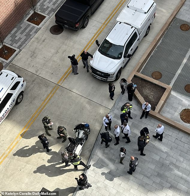 Eastern Market is located near Navy Yard, where violent crimes and carjackings have skyrocketed, with a 39 percent increase between 2022 and 2023. Pictured: Law enforcement officers hunt for an armed criminal who came across an apartment building in Navy Yard last month and remains at large