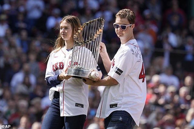 Brianna and brother Trevor hoisted the 2004 trophy and hugged their father's teammates