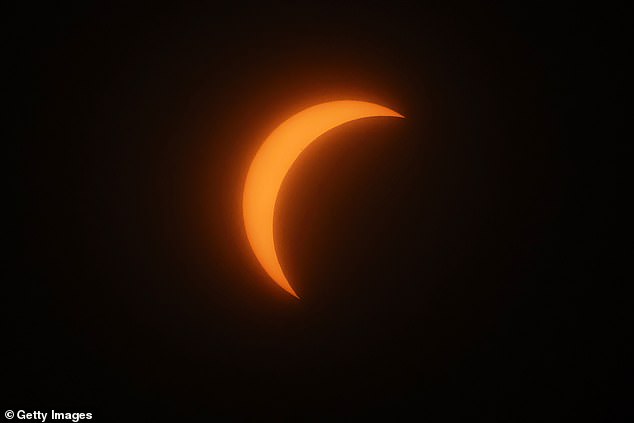 The partial solar eclipse as seen from the Top of the Rock at Rockefeller Center on April 8, 2024 in New York City.  The city was not in the path of totality, but did see 90 percent of the sun covered by the moon.