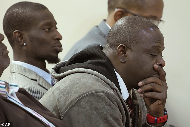 Michael Corey Jenkins, left, and Eddie Terrell Parker, foreground, stood in the courtroom Wednesday