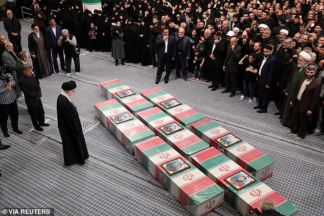 Iran's Supreme Leader Ayatollah Ali Khamenei looks at the coffins of Islamic Revolutionary Guard Corps members killed in the Israeli airstrike on the Iranian embassy complex in the Syrian capital Damascus