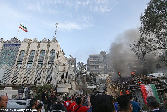 Emergency services and security personnel search the rubble at the site of the attack on a building annexed to the Iranian embassy in the Syrian capital Damascus, on April 1, 2024