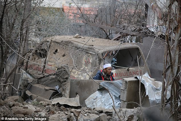 A decommissioned minibus is seen after Israeli airstrikes on southern Lebanon